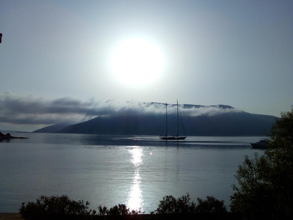 Sunset over the sea with a sailboat
