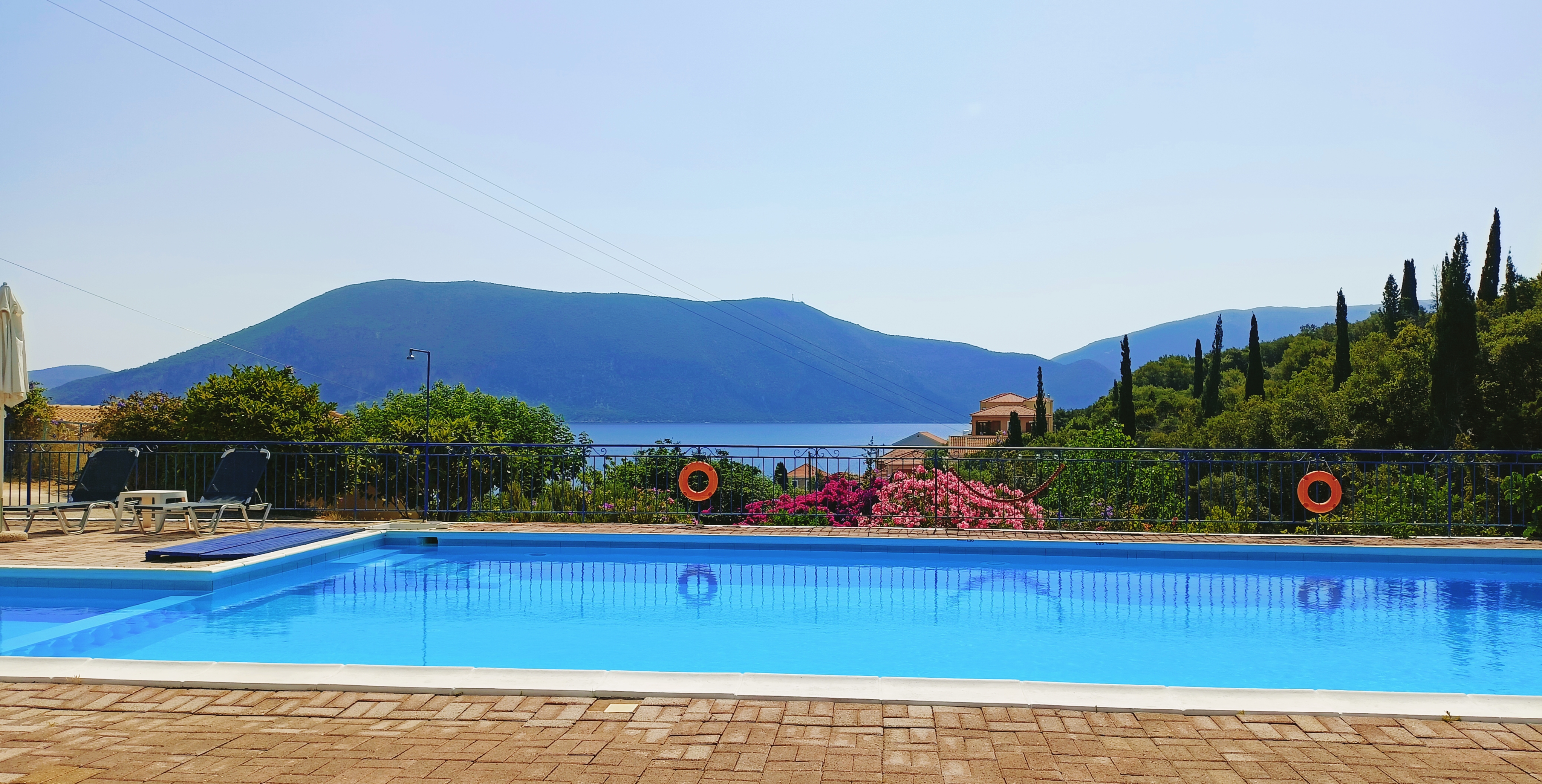 Swimming pool with a view of the sea and mountains